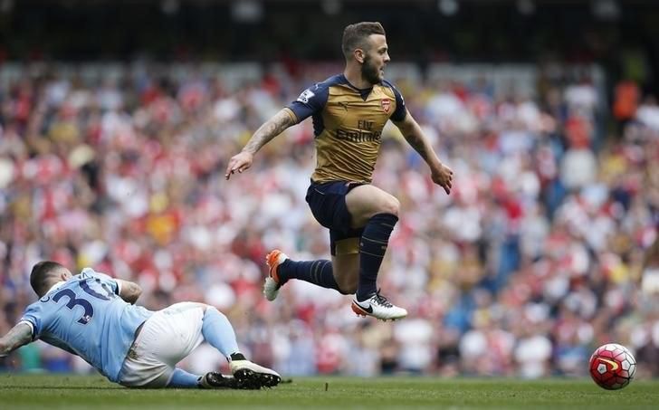 Arsenal's Jack Wilshere in action with Manchester City's Nicolas Otamendi. Britain Soccer Football - Manchester City v Arsenal - Barclays Premier League - Etihad Stadium - 8/5/16