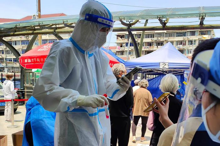 People queue for Covid-19 tests in Shanghai, China.