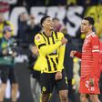 Jude Bellingham of Borussia Dortmund with Bayern Munich's Jamal Musiala during their Bundesliga match