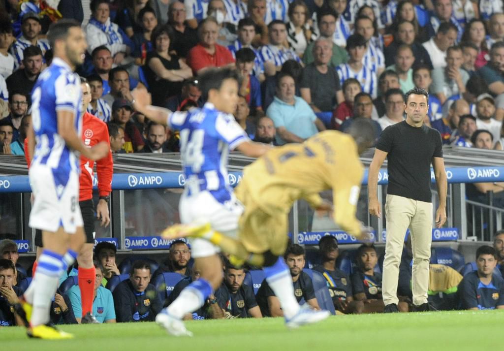 Xavi watches on as Barcelona thrashed Real Sociedad