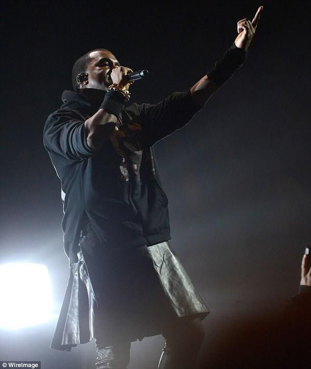 Kanye West wearing a skirt to perform [Dailymail]