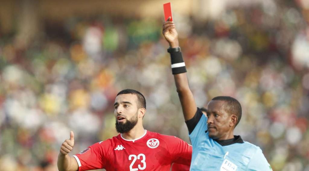 Referee Bamlak Tessema Weyesa showing the red to Mali's Moussa Sissako