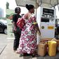 A fuel station attendant dispenses kerosene at a Nigerian National Petroleum Corporation (NNPC) mega petrol station in Abuja January 23, 2015. REUTERS/ Afolabi Sotunde