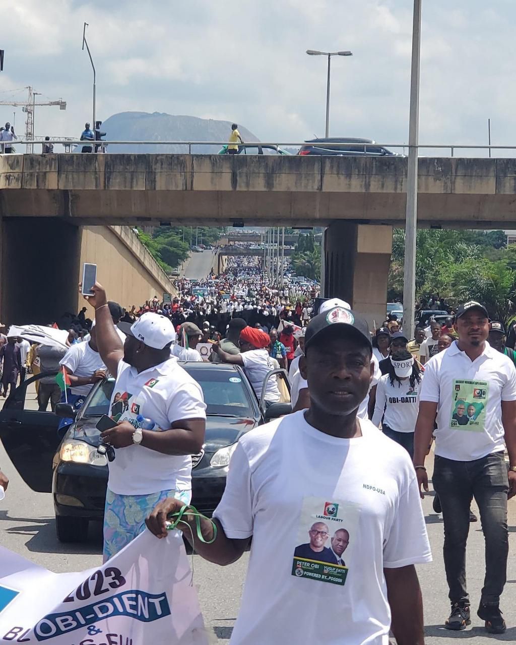 Peter Obi supporters throng Abuja streets for Obidient march .