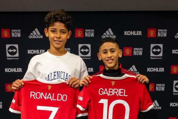 Cristiano Jr (L) has now signed a deal with Manchester United