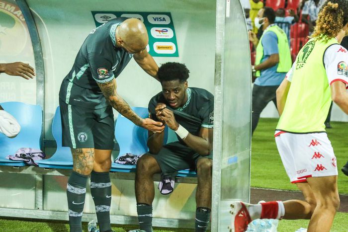 Super Eagles captain Troost-Ekong comforting Ola Aina.