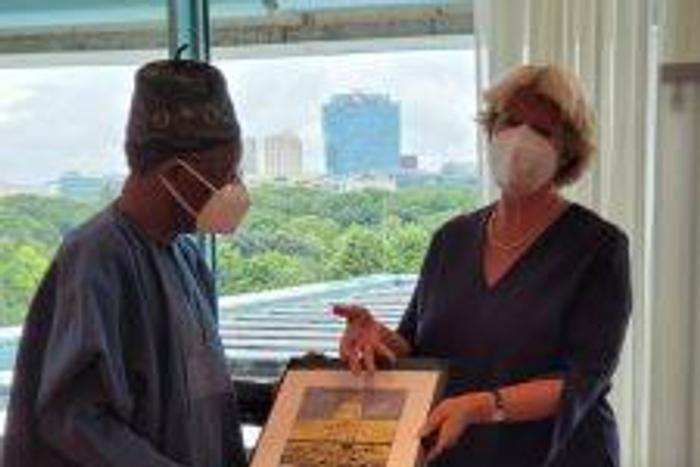 The German Minister of State for Culture, Prof. Moniker Grutters presenting a gift to the Minister of Information and Culture,Alhaji Lai Mohammed, during a meeting on the repatriation of looted Benin Bronzes to Nigeria, in Berlin, Germany. [NAN]