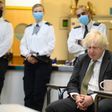 Prime Minster Boris Johnson speaks with members of the Metropolitan Police in their break room, as he makes a constituency visit to Uxbridge police station on December 17, 2021.