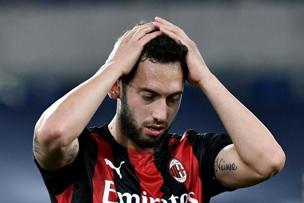 AC Milan's Turkish midfielder Hakan Calhanoglu reacts during the Italian Serie A football match Lazio vs Ac Milan at Olympic stadium in Rome on April 26, 2021.