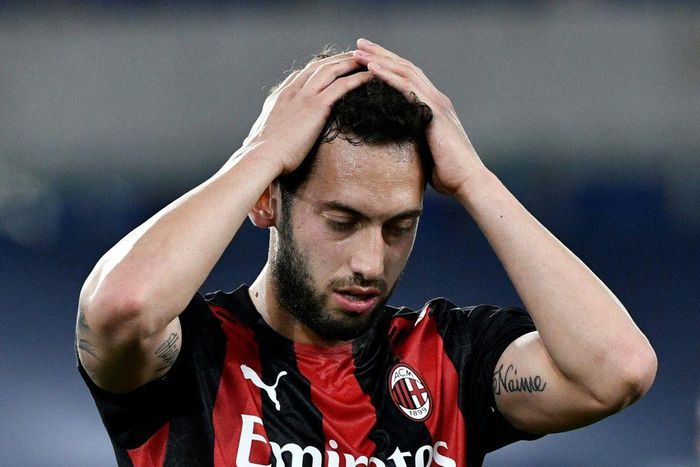 AC Milan's Turkish midfielder Hakan Calhanoglu reacts during the Italian Serie A football match Lazio vs Ac Milan at Olympic stadium in Rome on April 26, 2021.