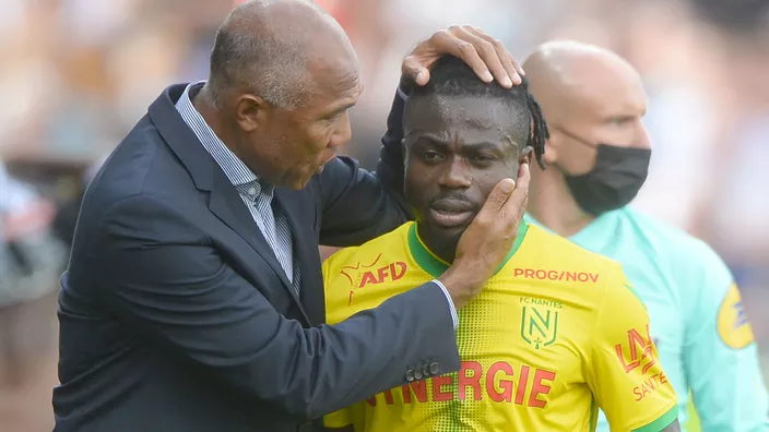 Nantes coach Antoine Kombouare and Moses Simon