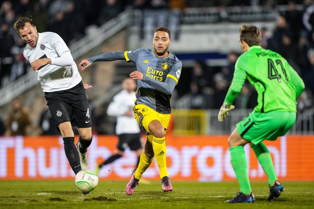 Cyriel Dessers celebrates his goal with the travelling fans