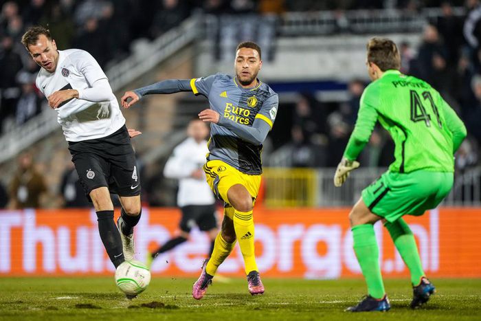 Cyriel Dessers celebrates his goal with the travelling fans