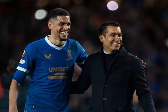 Leon Balogun (L) and Rangers manager Giovanni van Bronckhorst (R)