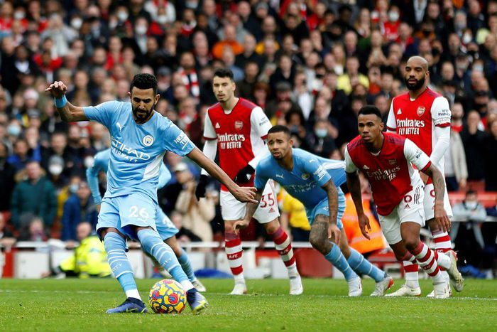 Algeria captain Riyad Mahrez (L) converts a penalty for Manchester City against Arsenal in the Premier League last weekend.