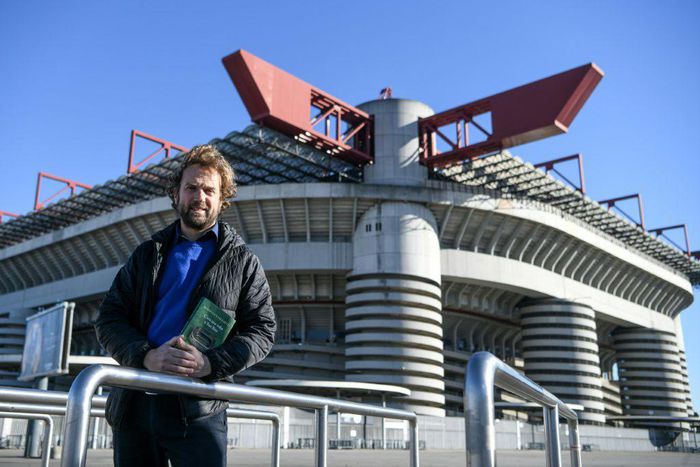 Gianfelice Facchetti, the son of late Italian football player Giacinto Facchetti, poses with his book "Once Upon a Time in San Siro" (C'era una volta a San Siro) outside the stadium in Milan