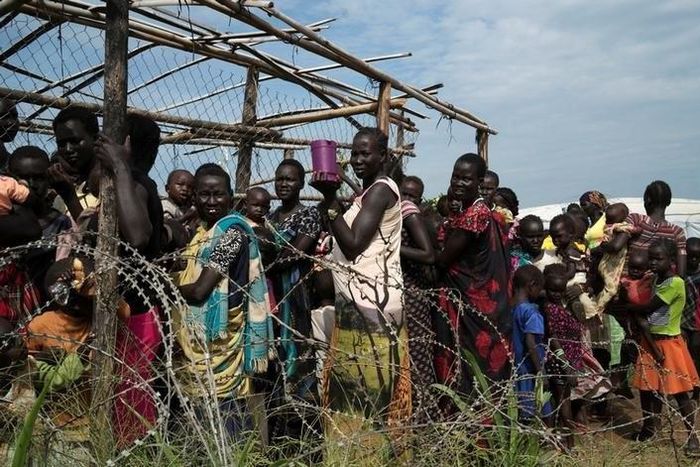 South Sudanese women and children queue to receive emergency food at the United Nations protection of civilians (POC) site 3 hosting about 30,000 people displaced during  fighting in Juba, South Sudan July 25, 2016. REUTERS/Adriane Ohanesian