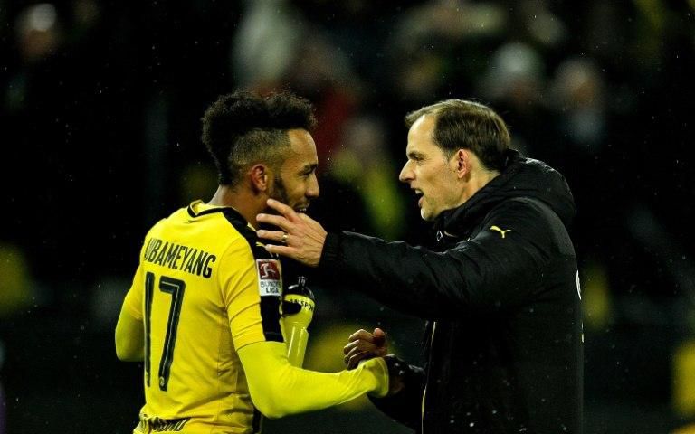 Dortmund's head coach Thomas Tuchel celebrates with forward Pierre-Emerick Aubameyang after their win against Leipzig, in Dortmund, western Germany, on February 4, 2017