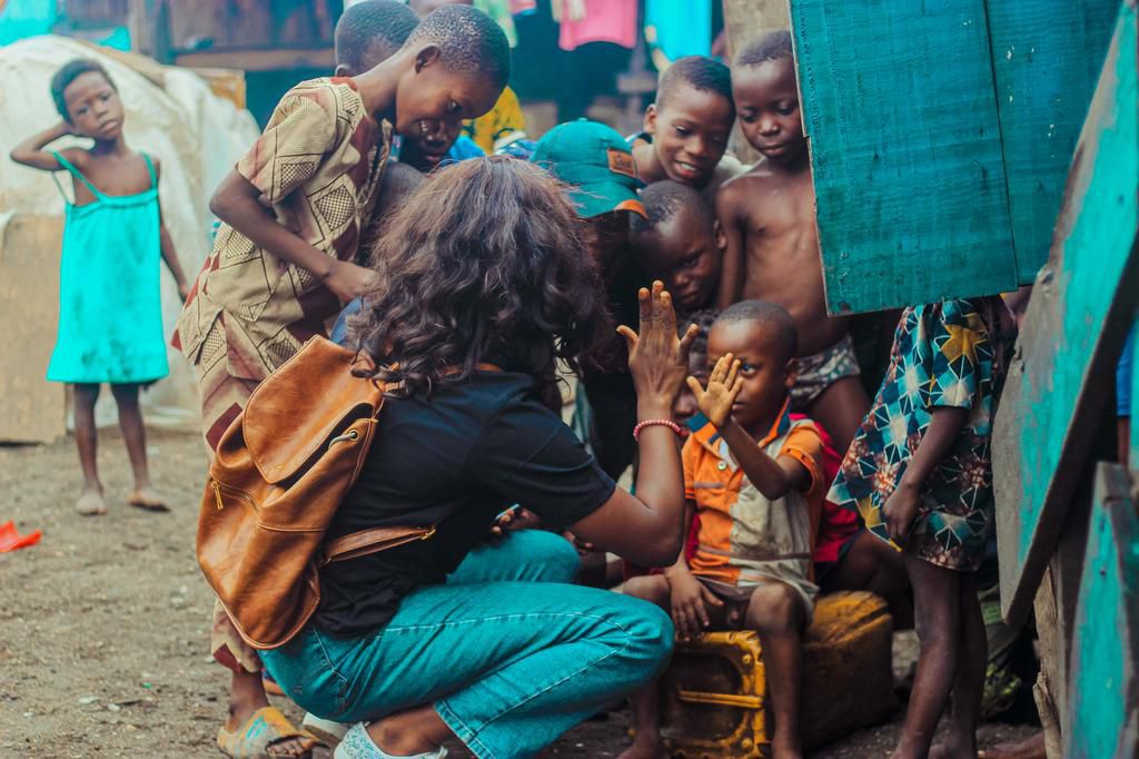 Team member with kids of Makoko community