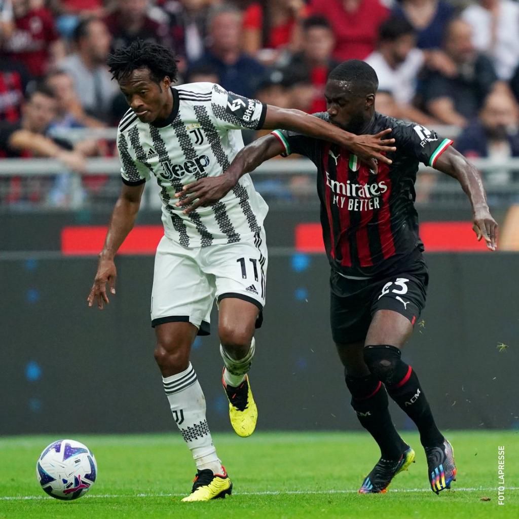 Juan Caudrado holds off Fikayo Tomori in Juventus clash against AC Milan in Serie A