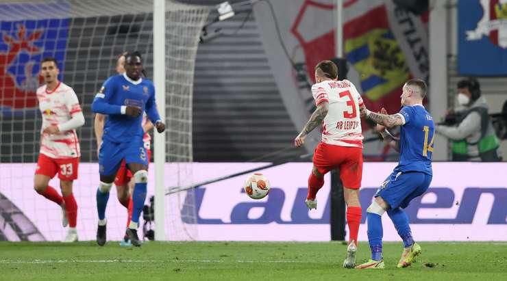 Calvin Bassey (second left) watches on as Angelino (second right) scores for Leipzig with a left-footed strike