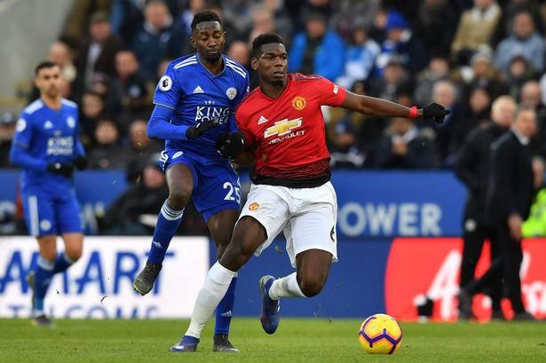 Wilfred Ndidi tries to wrestle the ball off Manchester United's Paul Pogba