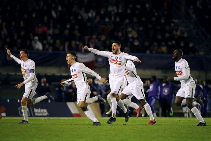 Versailles players celebrate after beating Bergerac on penalties in the French Cup quarter-finals