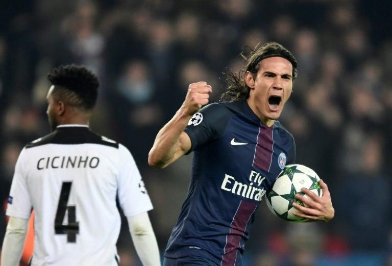 Paris Saint-Germain's Edinson Cavani (R) celebrates after scoring a goal during their UEFA Champions League Group A match against PCF Ludogorets Razgrad, at the Parc des Princes Stadium in Paris, on December 6, 2016