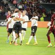 Max-Alain Gradel celebrates with Ahmed Musa and his other Sivasspor teammates after scoring a goal during the UEFA Conference League Group G game against CFR Cluj