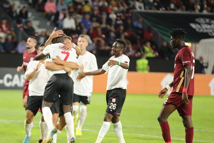 Max-Alain Gradel celebrates with Ahmed Musa and his other Sivasspor teammates after scoring a goal during the UEFA Conference League Group G game against CFR Cluj