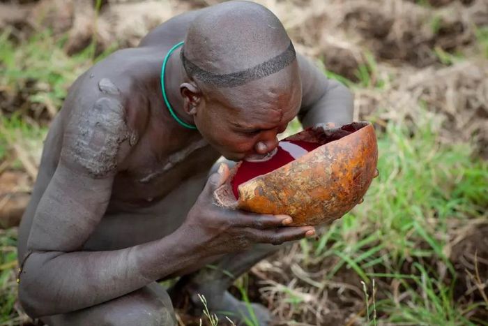 A suri warrior drinking blood [TheSun/Exclusivepix]