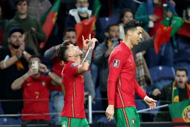 Otavio (L) opened the scoring for Portugal and set up their second