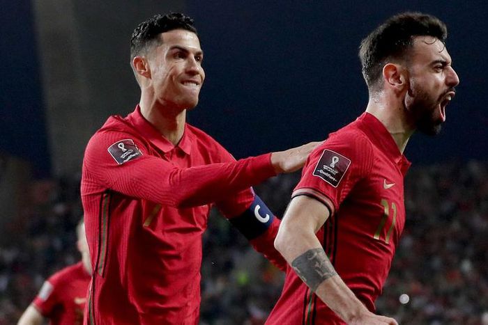 Cristiano Ronaldo celebrates with Portugal and Manchester United teammate Bruno Fernandes
