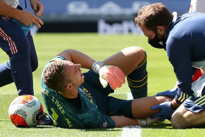Arsenal goalkeeper Bernd Leno was stretchered off with a knee injury