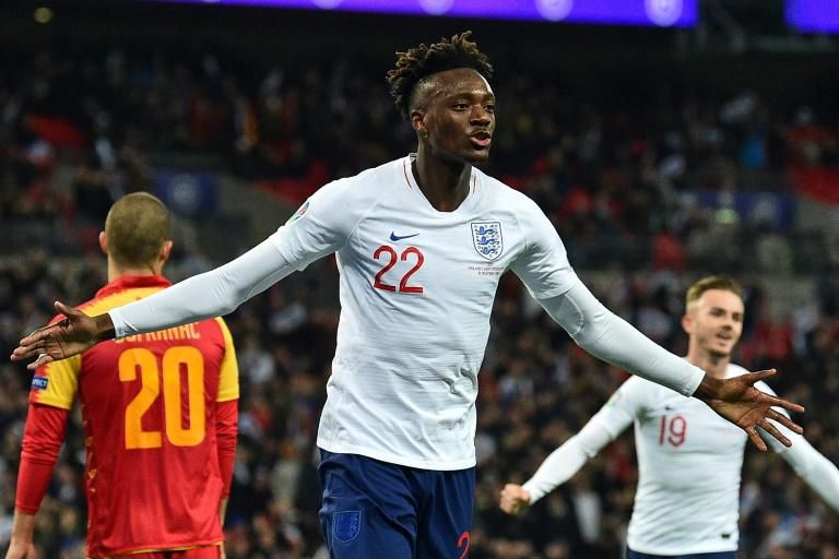 England striker Tammy Abraham celebrates after scoring their seventh goal against Montenegro