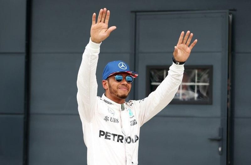 Britain Formula One - F1 - British Grand Prix 2016 - Silverstone, England - 9/7/16 Mercedes' Lewis Hamilton celebrates qualifying in pole position