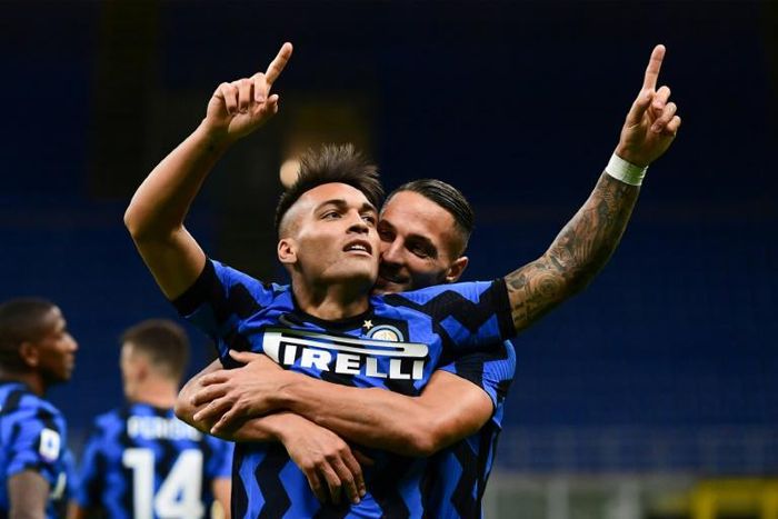 Lautaro Martinez (L) and Danilo D'Ambrosio both scored as Inter Milan kicked off their season with a win over Fiorentina in the San Siro.