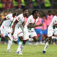 Burkina Faso players celebrate after winning a penalty shootout against Gabon in an Africa Cup of Nations last-16 match in Limbe