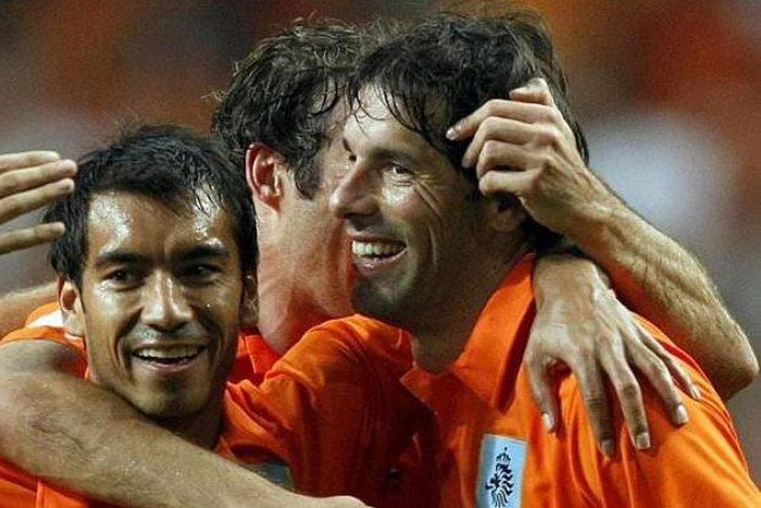 Brothers at war - van Bronckhorst and van Nistelrooy.