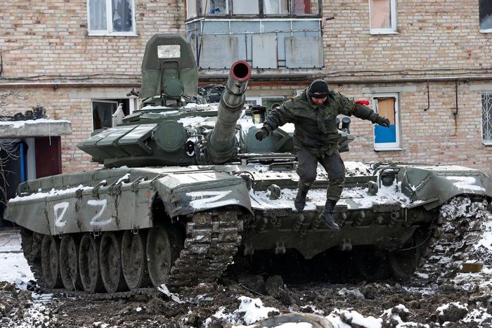 A member of pro-Russian forces jumps off a tank in the separatist-controlled town of Volnovakha in Ukraine's Donetsk region, March 11, 2022.