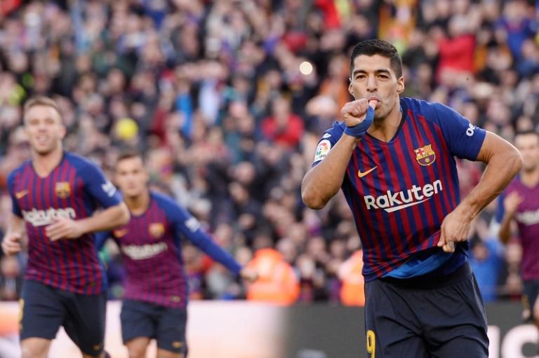 Luis Suarez celebrates scoring against Real Madrid at the Camp Nou -- he netted a hat-trick as Barca won 5-1 in October's Clasico