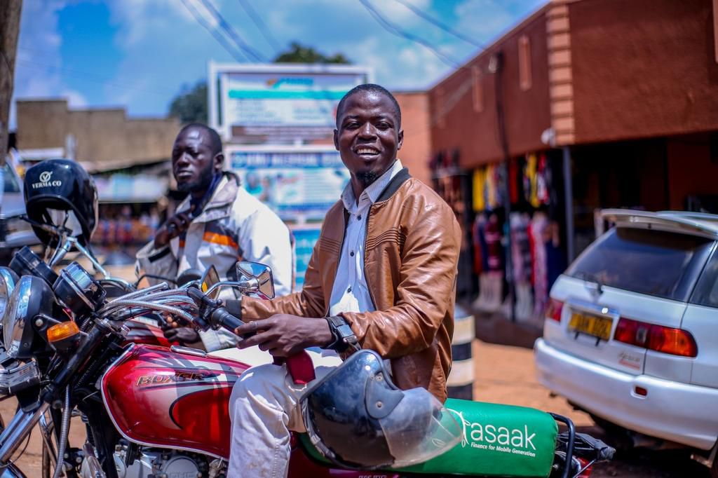 A Ugandan commercial motorbike operator with his Asaak branded motorbike