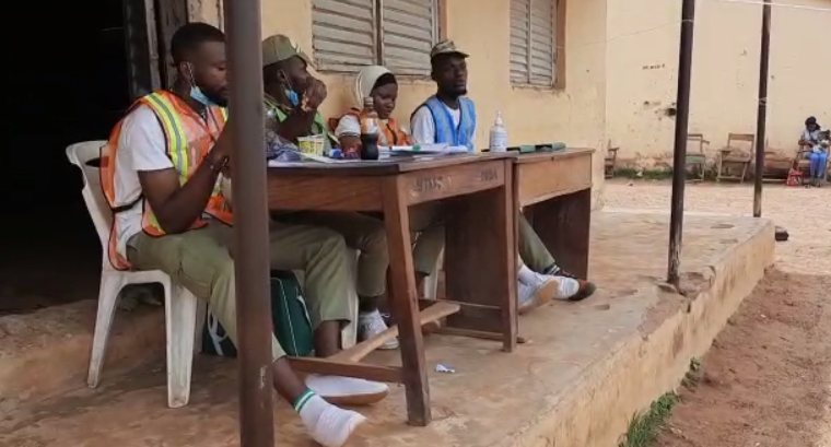 INEC officials waiting for voters to come forward to cast their votes.