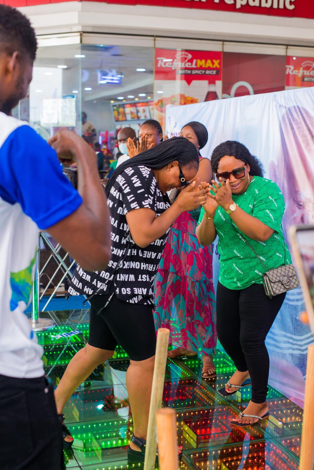 Parents participate in games at OMO's Mother's Day celebration (2)