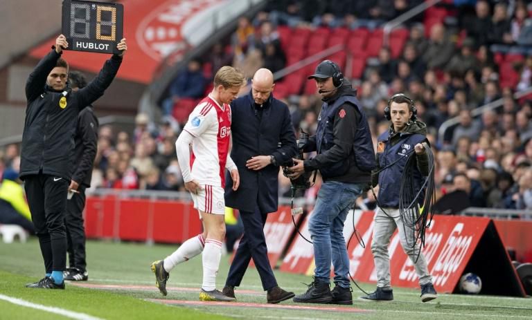 Ajax's Frenkie de Jong (C) is a doubt after going off injured during a Dutch league game at the weekend