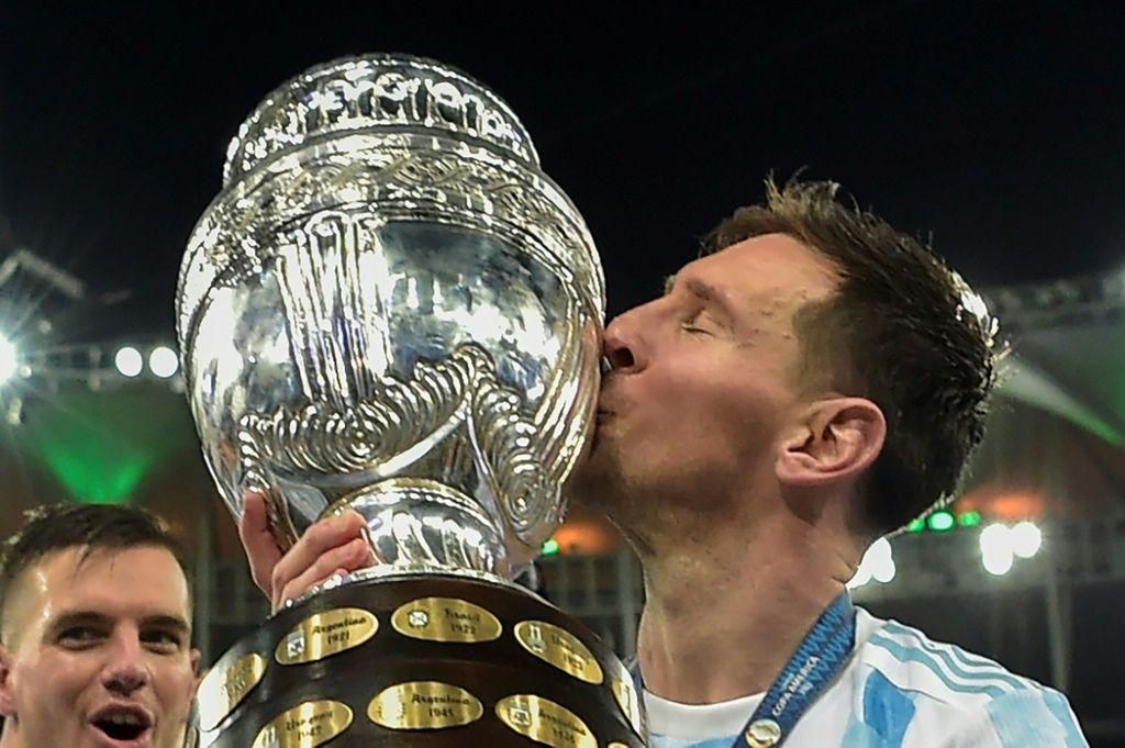 Argentina's Lionel Messi kisses the trophy after winning the Copa America for the first time following a 1-0 win over Brazil