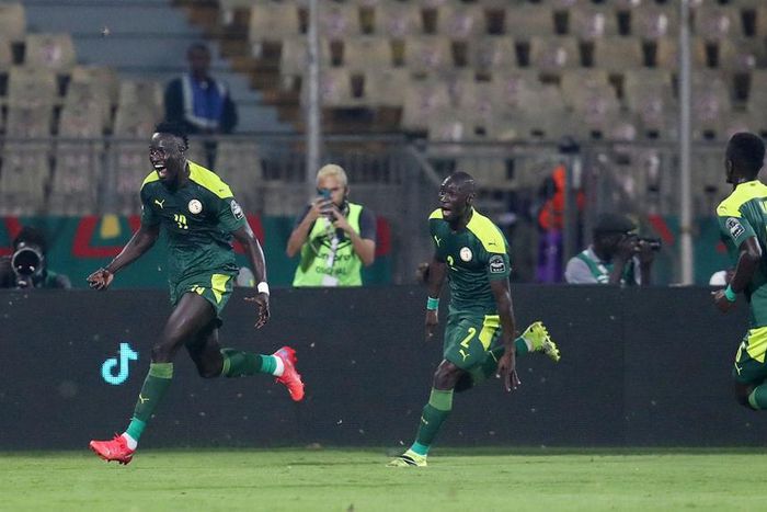 Famara Diedhiou celebrates wildly after scoring the opener against Equatorial Guinea.
