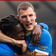 Calvin Bassey and Borna Barisic celebrate.