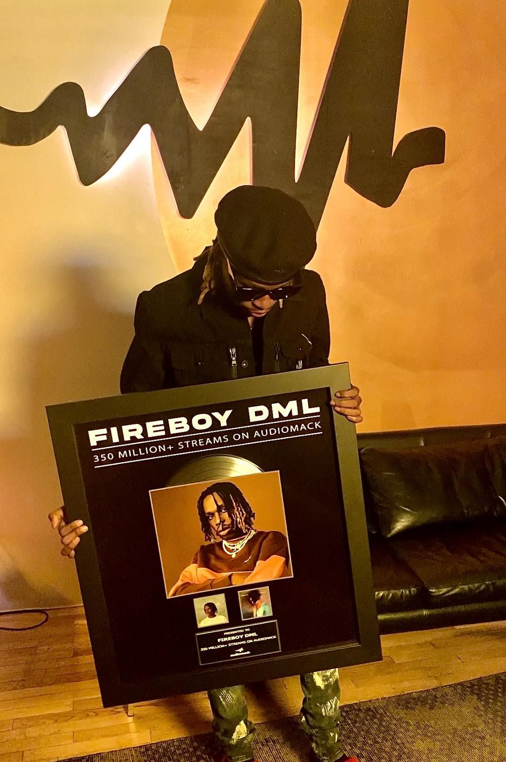 Fireboy DML receives plaque from Audiomack for hitting over 350 million streams