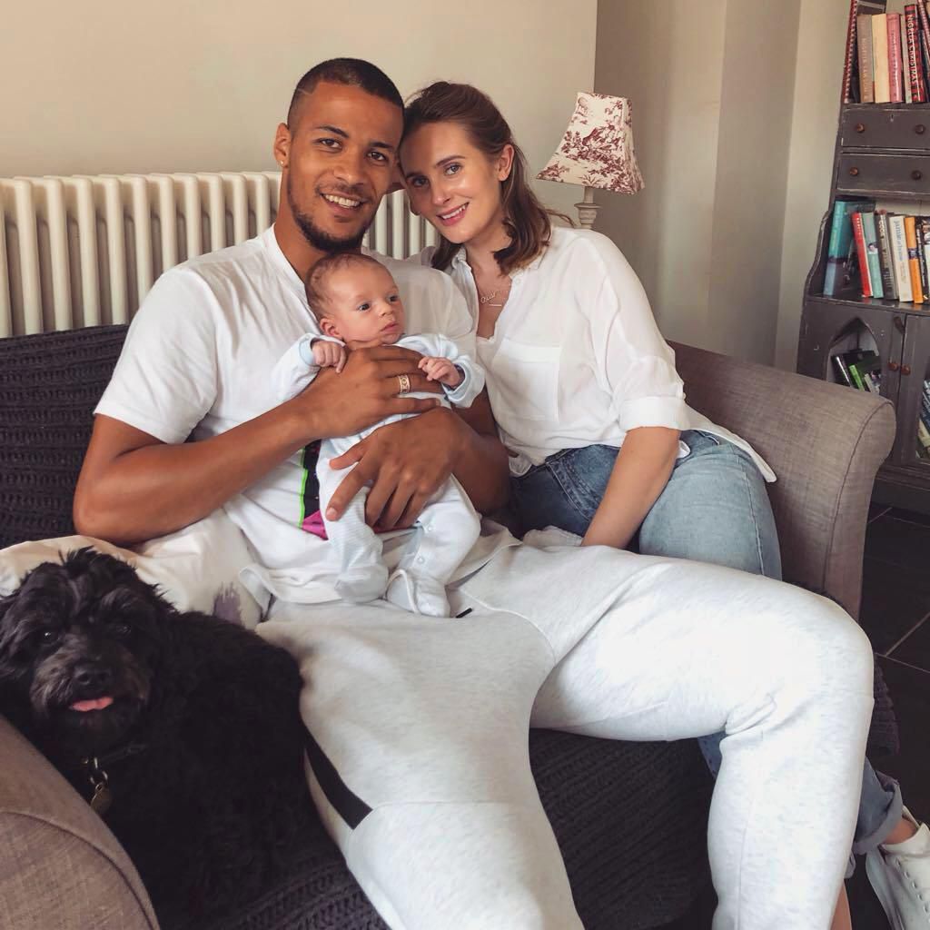 William Troost Ekong with his fiancee and son